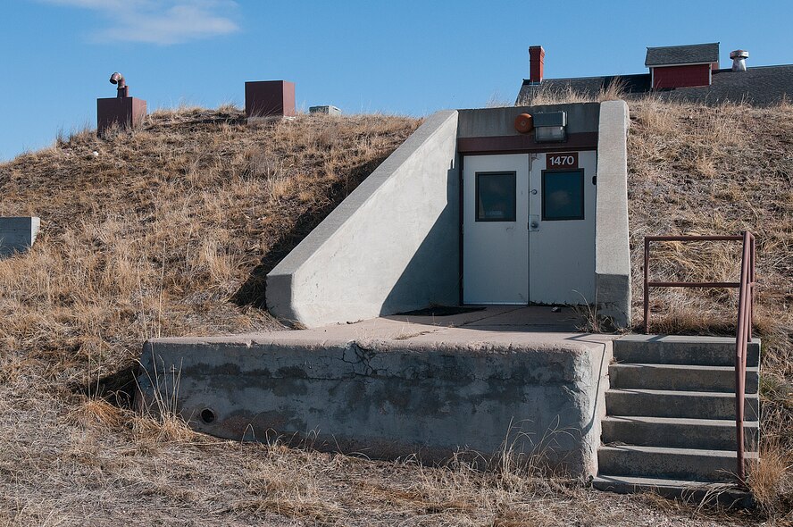 A doorway leads to the underground curation facility, known as “the bunker” on F. E. Warren Air Force Base. The structure, originally built around the turn of the last century for the storage of potatoes, is a climate-controlled facility for the storage of historical documents and artifacts. (U.S. Air Force photo by R.J. Oriez)