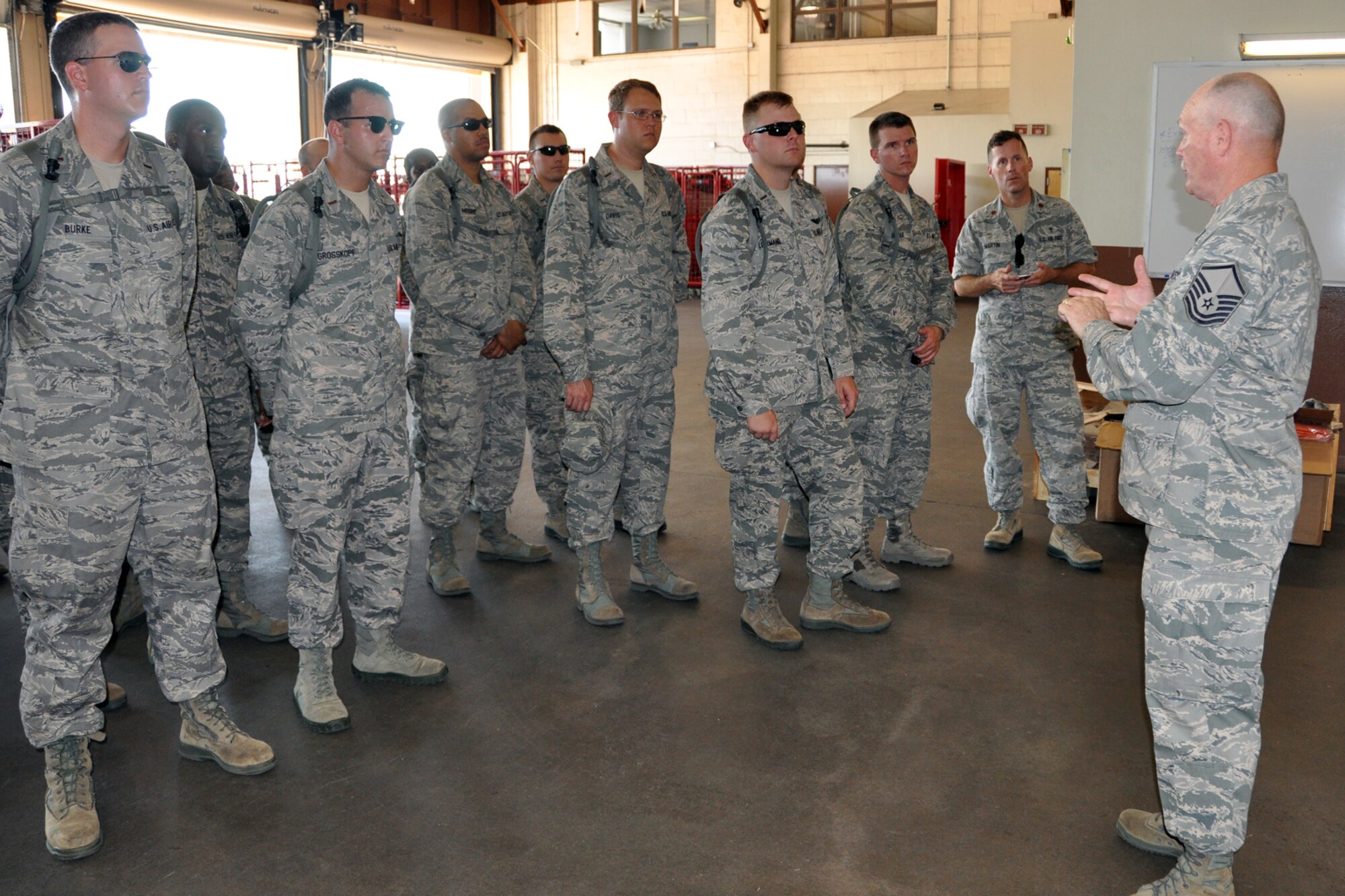 U.S. Air Force Master Sgt. Jackie Kirkwood, NCOIC Chapel Services, 307th Bomb Wing, addresses a group of Air Force Chaplain Candidates at the fire department during their visit to Barksdale Air Force Base, La., July 31, 2012. Barksdale was the second stop for the 28 candidates as part of The Chaplain Candidate Intensive Internship, which is a program designed to provide a structured opportunity for students to test their call and suitability for service as Air Force chaplains. Kirkwood has been involved in that program for several years. (U.S. Air Force photo by Master Sgt. Jeff Walston)