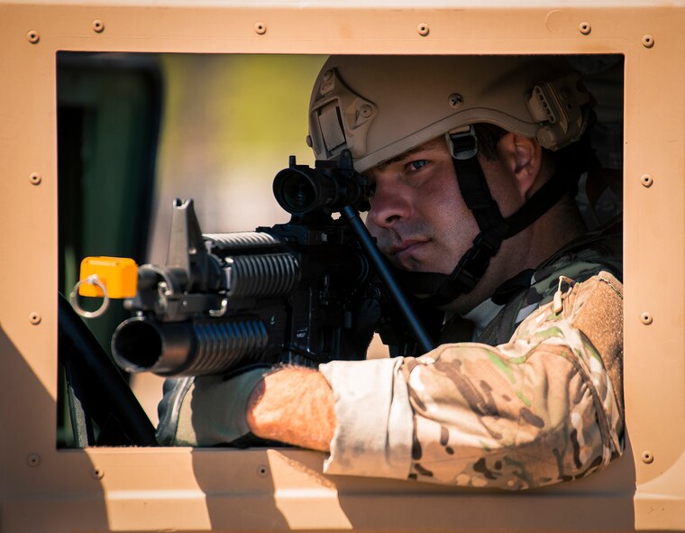 A 919th Security Forces Squadron Airman guards the perimeter from a HMMWV during an extraction exercise at Duke Field, Fla., April 6. The Security Forces Airmen executed this training exercise with the trainees from the Development and Training Program. The DTP is an Air Force Reserve Command introductory program to help recruits prepare for military life prior to going to basic military training. The trainees were given a first-hand view of the procedures performed to recover American personnel from a downed aircraft in a hostile environment. (U.S. Air Force photo/Tech. Sgt. Samuel King Jr.)
