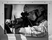 A 919th Security Forces Squadron Airman guards the perimeter from a HMMWV during an extraction exercise at Duke Field, Fla., April 6. The Security Forces Airmen executed this training exercise with the trainees from the Development and Training Program. The DTP is an Air Force Reserve Command introductory program to help recruits prepare for military life prior to going to basic military training. The trainees were given a first-hand view of the procedures performed to recover American personnel from a downed aircraft in a hostile environment. (U.S. Air Force photo/Tech. Sgt. Samuel King Jr.)