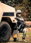A 919th Security Forces Squadron Airman guards the back of a HMMWV during an extraction exercise at Duke Field, Fla., April 6. The Security Forces Airmen executed this training exercise with the trainees from the Development and Training Program. The DTP is an Air Force Reserve Command introductory program to help recruits prepare for military life prior to going to basic military training. The trainees were given a first-hand view of the procedures performed to recover American personnel from a downed aircraft in a hostile environment. (U.S. Air Force photo/Tech. Sgt. Samuel King Jr.)