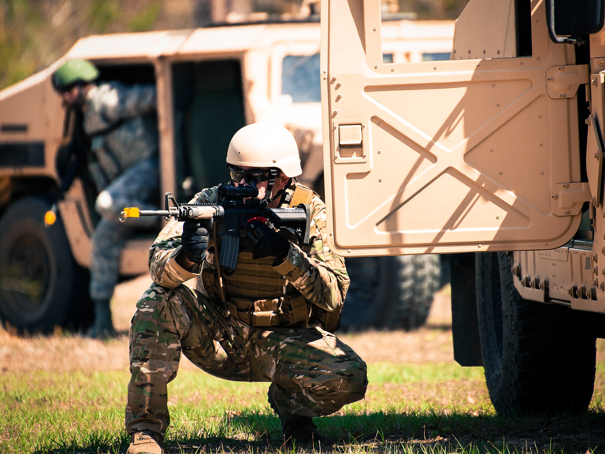 Staff Sgt. Thomas Maloney, a 919th Security Forces Squadron, guards the perimeter from a HMMWV during an extraction exercise at Duke Field, Fla., April 6. The Security Forces Airmen executed this training exercise with the trainees from the Development and Training Program. The DTP is an Air Force Reserve Command introductory program to help recruits prepare for military life prior to going to basic military training. The trainees were given a first-hand view of the procedures performed to recover American personnel from a downed aircraft in a hostile environment. (U.S. Air Force photo/Tech. Sgt. Samuel King Jr.)