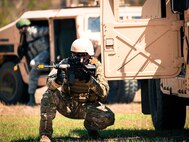Staff Sgt. Thomas Maloney, a 919th Security Forces Squadron, guards the perimeter from a HMMWV during an extraction exercise at Duke Field, Fla., April 6. The Security Forces Airmen executed this training exercise with the trainees from the Development and Training Program. The DTP is an Air Force Reserve Command introductory program to help recruits prepare for military life prior to going to basic military training. The trainees were given a first-hand view of the procedures performed to recover American personnel from a downed aircraft in a hostile environment. (U.S. Air Force photo/Tech. Sgt. Samuel King Jr.)