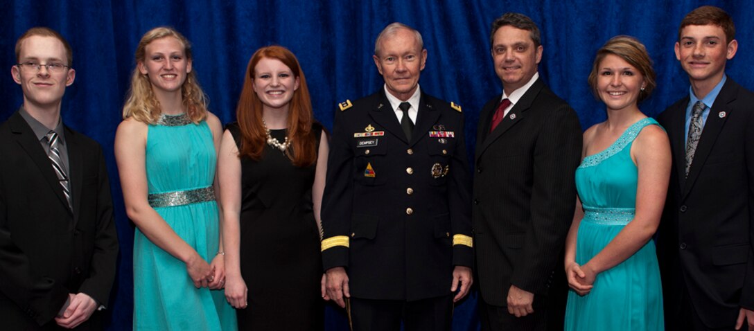 Army Gen. Martin E. Dempsey and Jim Knotts pose with Military Child of the Year honorees, from left to right, Alexander Ray Burch, Navy; Abigail MaryRose Perdew, Marine Corps; Amanda Wimmersberg, Coast Guard; Nicole Marie Daly, Army and Mark Michael Newberry, Air Force at the 5th Annual Military Child of the Year Awards Gala hosted by Operation Homefront at the Ritz-Carlton hotel in Arlington, Va., April 11, 2013. Dempsey is the chairman of the Joint Chiefs of Staff. Knotts is the president and chief executive officer of Operation Homefront. (DOD photo/U.S. Army Staff Sgt. Sun L. Vega)