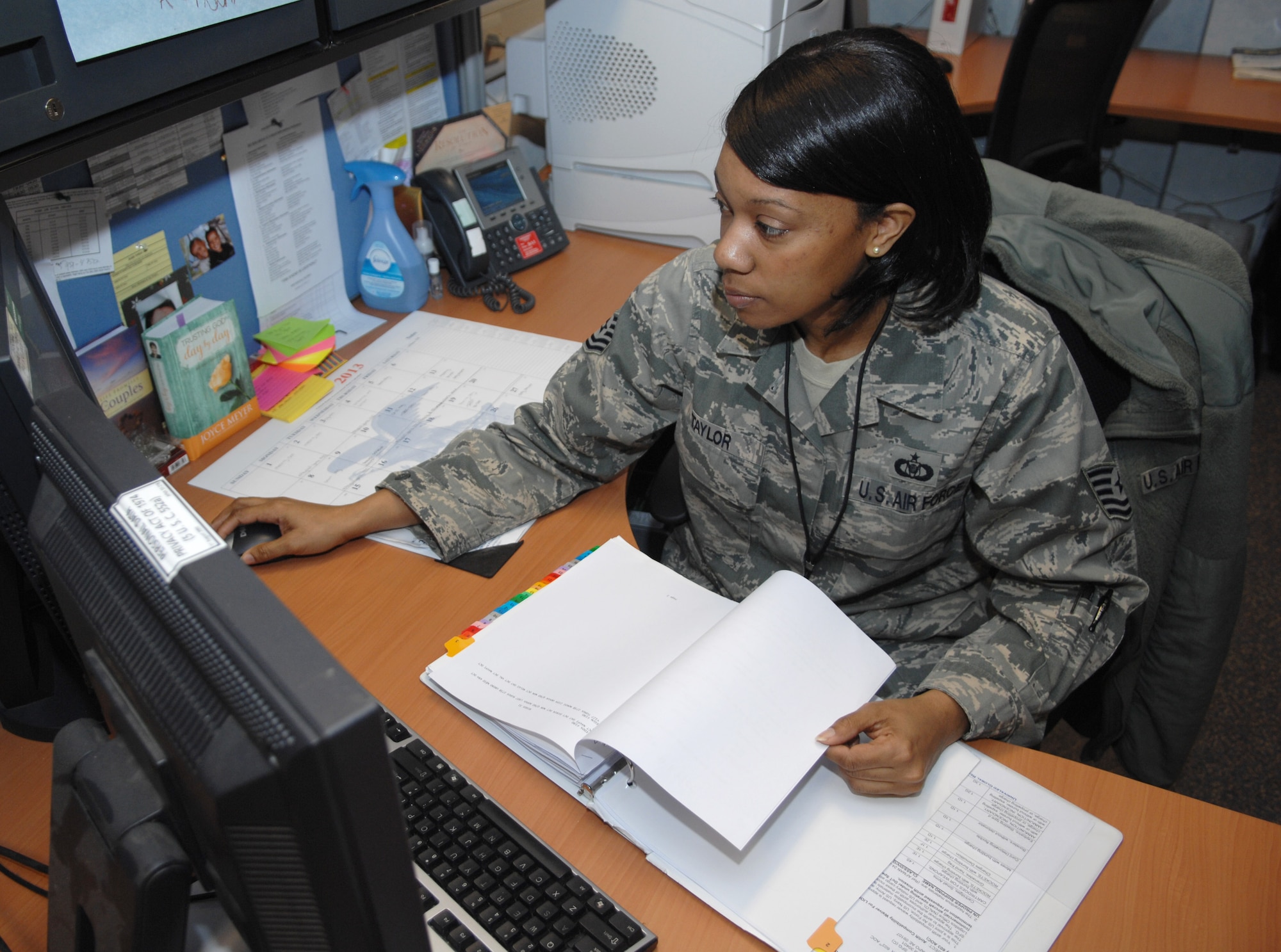 Tech. Sgt. Tai Taylor, 352nd Special Operations Support Squadron group current operations NCO in charge, publishes diplomatic clearances April 12, 2013, on RAF Mildenhall, England. (U.S. Air Force photo by Airman 1st Class Dillon Johnston/Released)