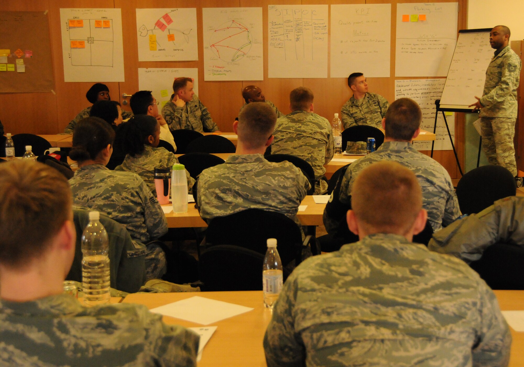 More than 50 students of the Air Force Smart Operations for the 21st Century Green Belt Process Improvement Class listen to a student presentation inside the 435th Construction Training Squadron Auditorium at Ramstein Air Base, Germany April 4, 2013. The class consisted of 55 students, the largest in Air Force history and focused on improving work center processes while removing waste or non-value added activities  U.S. Air Force Photo by Tech. Sgt. James M. Hodgman