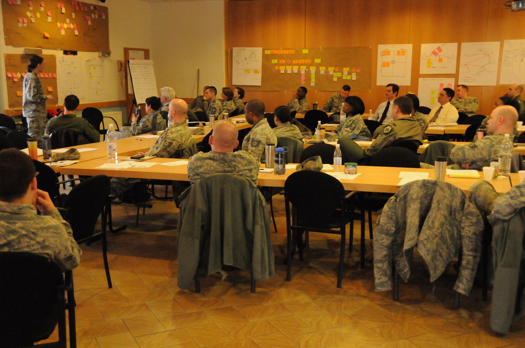 More than 50 students of the Air Force Smart Operations for the 21st Century Green Belt Process Improvement Class listen to a student presentation inside the 435th Construction Training Squadron Auditorium at Ramstein Air Base, Germany April 4, 2013. The class consisted of 55 students, the largest in Air Force history and focused on improving work center processes while removing waste or non-value added activities  U.S. Air Force Photo by Tech. Sgt. James M. Hodgman