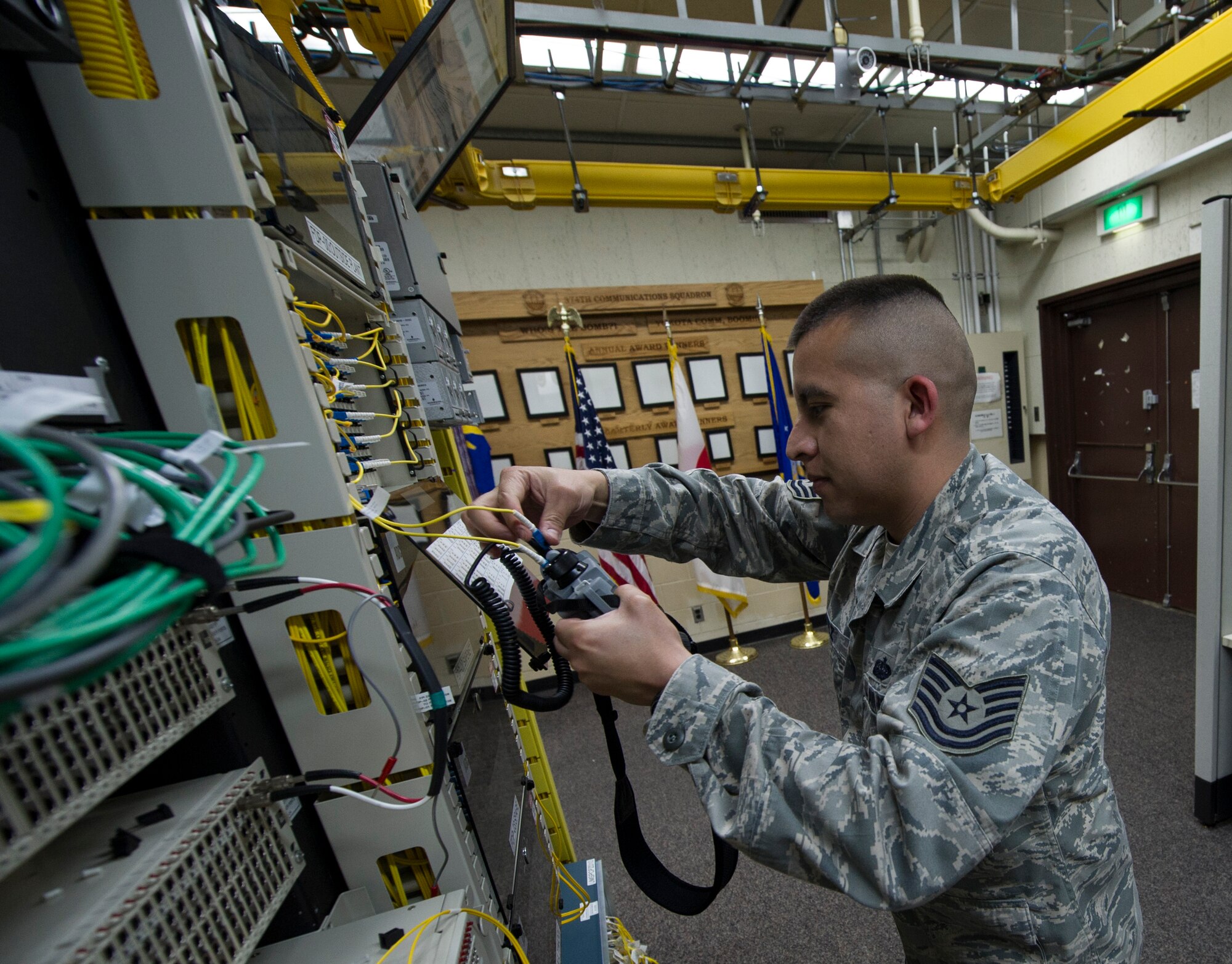 YOKOTA AIR BASE, Japan -- Tech. Sgt. Juan Lopez, 374th Communications Squadron circuit actions manager, tests a circuit coming in from another site, April 9, 2013 at Camp Zama, Japan. Circuit traffic from around the Pacific region is received by Zama's communications site and then pushed out to the world. (U.S. Air Force photo by Senior Airman Andrea Salazar/Released)