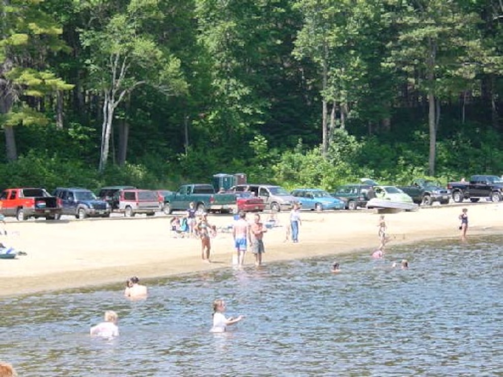 Families swimming at Townshend Lake, Townshend, Vt., is nestled in the foothills of the Green Mountains and offers lots of outdoor recreation fun. Families come to enjoy the extensive shaded picnic areas overlooking the swimming and play areas. Picnic tables, grills, horseshoe pits, volleyball set-ups, grassy play areas, and two modern restrooms are provided for the enjoyment of our visitors.