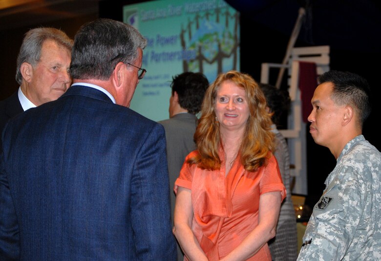 Following “The Power of Partnerships” conference, Col. Mark Toy, commander of the Corps’ Los Angeles District, converses with (l to r) Phil Anthony, chair of SAWPA and a member of the Board of Directors of the Orange County Water District, Mike Marcus, general manger of the Orange County Water District, and Celeste Cantu, general manager for SAWPA. The Santa Ana Watershed Project Authority sponsored the conference held April 11 in Costa Mesa, Calif.