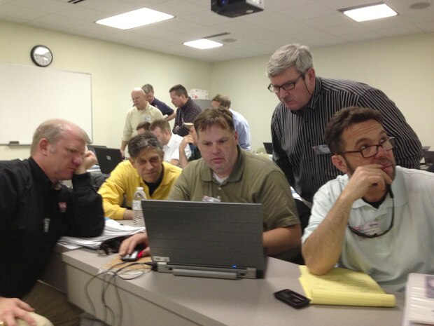 From left:  Jason Adams, Larry McIntosh, Blaine Guidry, Garry Runyans and Raul Alonso work on a community group site design during a four-day training session to become Level 2 certified members of Huntsville Center's Housing Planning and Response team. Training was April 2-5, 2013, in Suffolk, Va. 