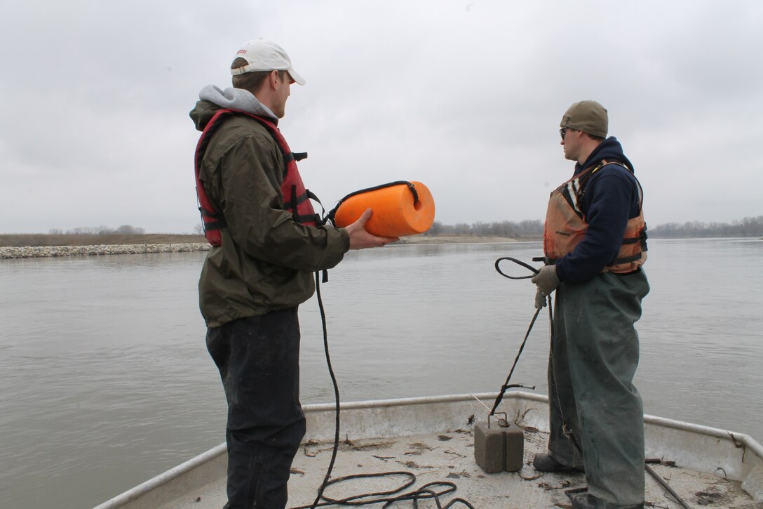 Trotlines are reset with anchors and buoys marking each end of the line during pallid sturgeon broodstock collection with the Nebraska Game and Parks Commission on the Missouri River, April 8.