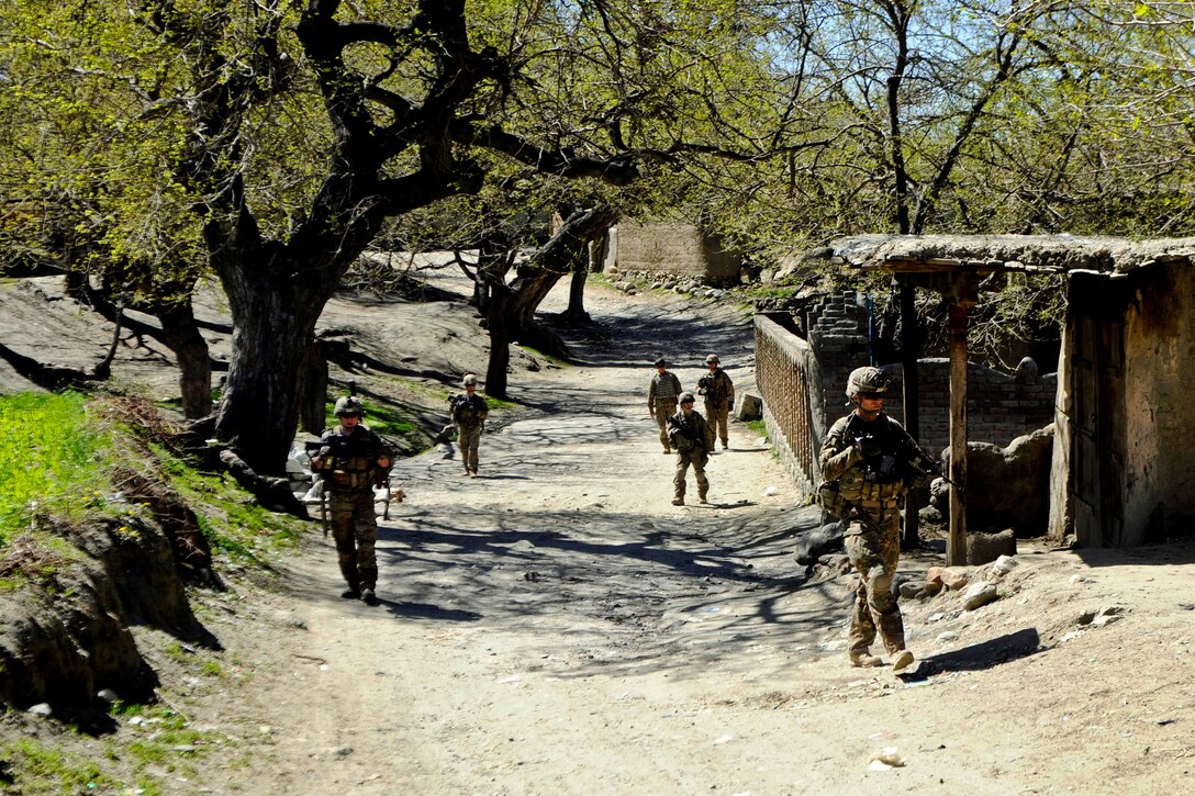 U.S. soldiers conduct a patrol through a local bazaar in the Khogyani district of Afghanistan’s Nangarhar province, March 30, 2013.
