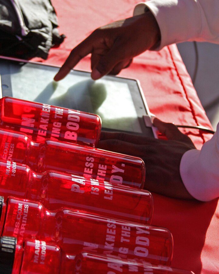 A participant signs up for the Chin-Up Challenge during the Taco Bell Track & Field Classic on April 13 at Spring Valley High School in Columbia, S.C. The annual event attracts more than 100 high schools from throughout the Carolinas. (Marine Corps Photo by Sgt. Aaron Rooks)