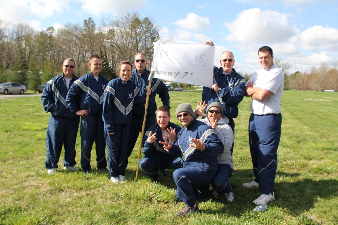 The "Lucky 7s" are all smiles after posting high marks during the second annual 932nd Maintenance Group Team Building challenge.  Teams had to complete ten stations that tested teamwork and physical prowess.  Stations were located around the Scott Lake area. Master Sgt. Keena Collier said the half-day event was challenging and "really helps build unit morale."   (U.S. Air Force photo/Tech. Sgt. Daniel Oliver)