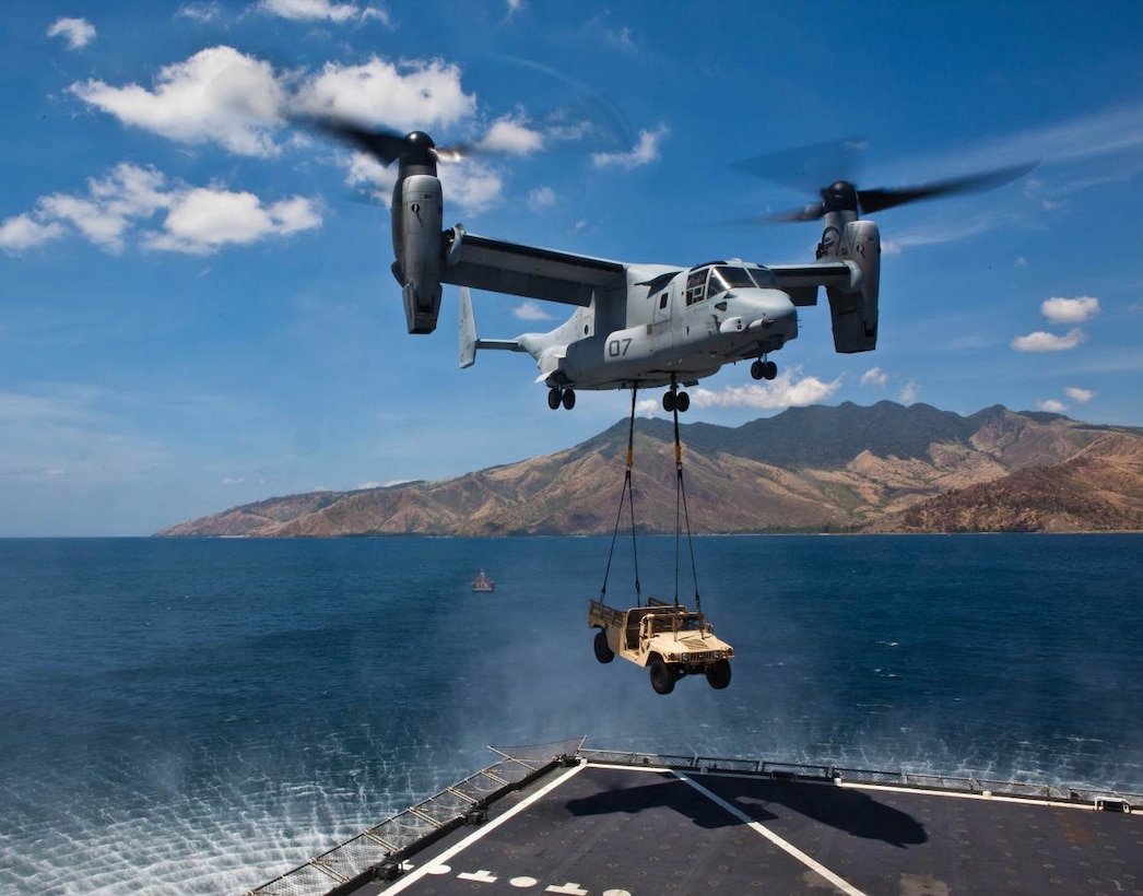SUBIC BAY, Philippines – An MV-22B Osprey lifts a high mobility multipurpose wheeled vehicle from the USNS Sacagawea April 11 at Subic Bay, Republic of the Philippines, during exercise Freedom Banner 2013. The aircraft is with Marine Medium Tiltrotor Squadron 265, Marine Aircraft Group 36, 1st Marine Aircraft Wing. (U.S. Marine Corps photo by Pfc. Kasey Peacock/Released)