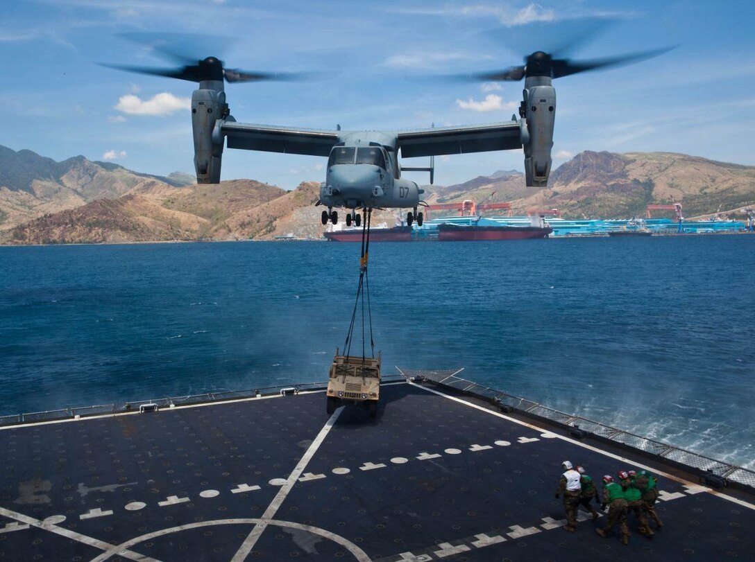 SUBIC BAY, Philippines –An MV-22B Osprey lifts a high mobility multipurpose wheeled vehicle during external lift training at Subic Bay, Republic of the Philippines, during exercise Freedom Banner 2013. This was the first time an Osprey has conducted an external lift with the USNS Sacagawea. The aircraft is with Marine Medium Tiltrotor Squadron 265, Marine Aircraft Group 36, 1st Marine Aircraft Wing. (U.S. Marine Corps photo by Pfc. Kasey Peacock/Released)