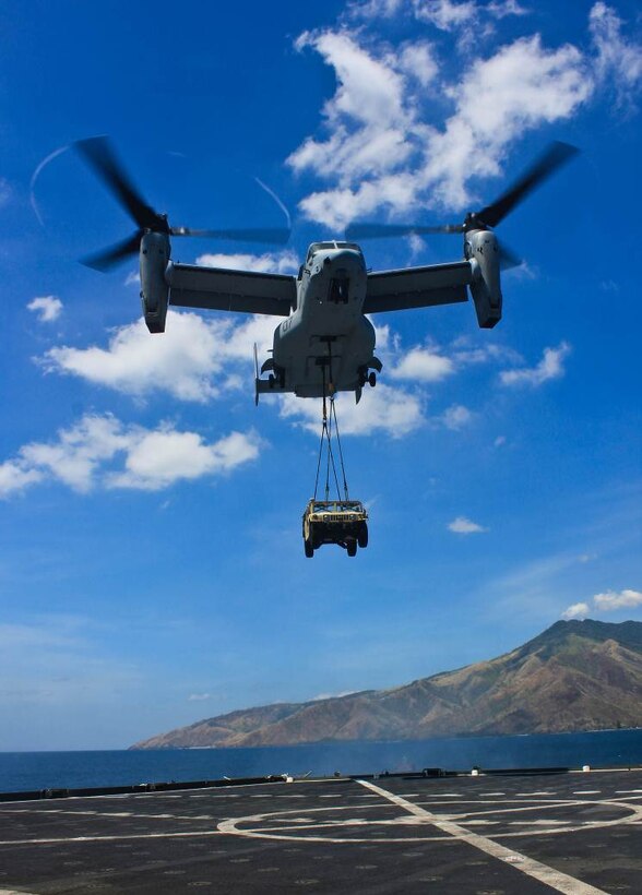 SUBIC BAY, Philippines – An MV-22B Osprey conducts the first external lift of a high mobility multipurpose wheeled vehicle from the USNS Sacagawea April 11 at Subic Bay, Republic of the Philippines, during exercise Freedom Banner 2013. The aircraft is with Marine Medium Tiltrotor Squadron 265, Marine Aircraft Group 36, 1st Marine Aircraft Wing.  (U.S. Marine Corps photo by 1st Lt. Breck B. Archer/Released)