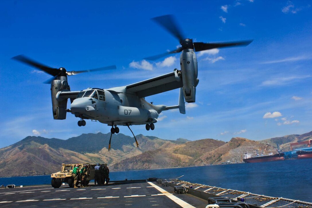 SUBIC BAY, Philippines – An MV-22B Osprey prepares to attach to a high mobility multipurpose wheeled vehicle during an external lift exercise April 11 at Subic Bay, Republic of the Philippines, during exercise Freedom Banner 2013. The training was the first time an Osprey has conducted an external lift with the USNC Sacagawea. The aircraft is with Marine Medium Tiltrotor Squadron 265, Marine Aircraft Group 36, 1st Marine Aircraft Wing. (U.S. Marine Corps photo by 1st Lt. Breck B. Archer/Released)