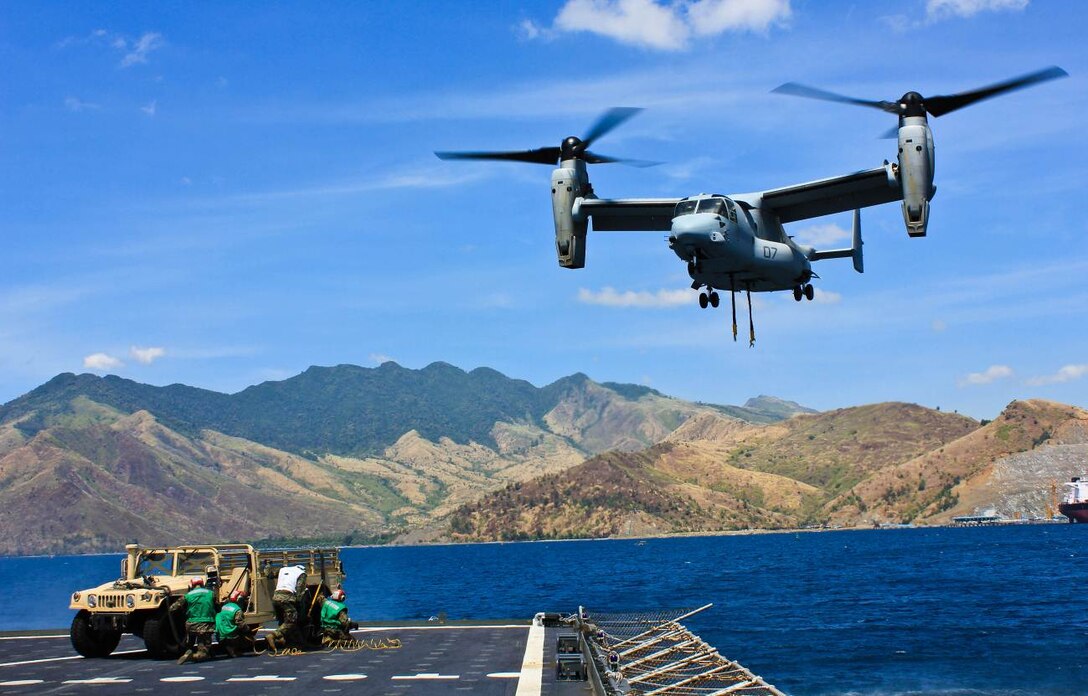 SUBIC BAY, Philippines – An MV-22B Osprey lifts a high mobility multipurpose wheeled vehicle off the deck of the USNS Sacagawea during an external lift exercise April 11 at Subic Bay, Republic of the Philippines, during exercise Freedom Banner 2013. The training was the first time an Osprey has conducted an external lift with the Sacagawea. The aircraft is with Marine Medium Tiltrotor Squadron 265, Marine Aircraft Group 36, 1st Marine Aircraft Wing. (U.S. Marine Corps photo by 1st Lt. Breck B. Archer/Released)