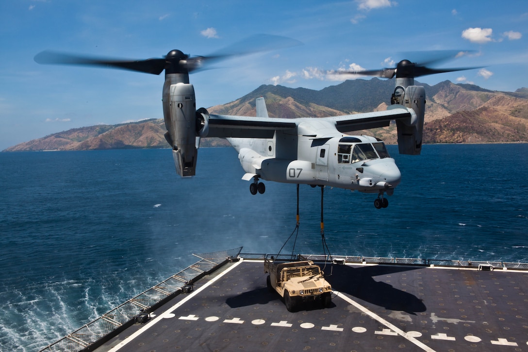 SUBIC BAY, Philippines – A U.S. Marine Corps MV-22B Osprey lifts a high mobility multipurpose wheeled vehicle from the USNS Sacagawea April 11 at Subic Bay, Republic of the Philippines, during exercise Freedom Banner 2013. The aircraft is with Marine Medium Tiltrotor Squadron 265, Marine Aircraft Group 36, 1st Marine Aircraft Wing. (U.S. Marine Corps photo by Pfc. Kasey Peacock/Released)