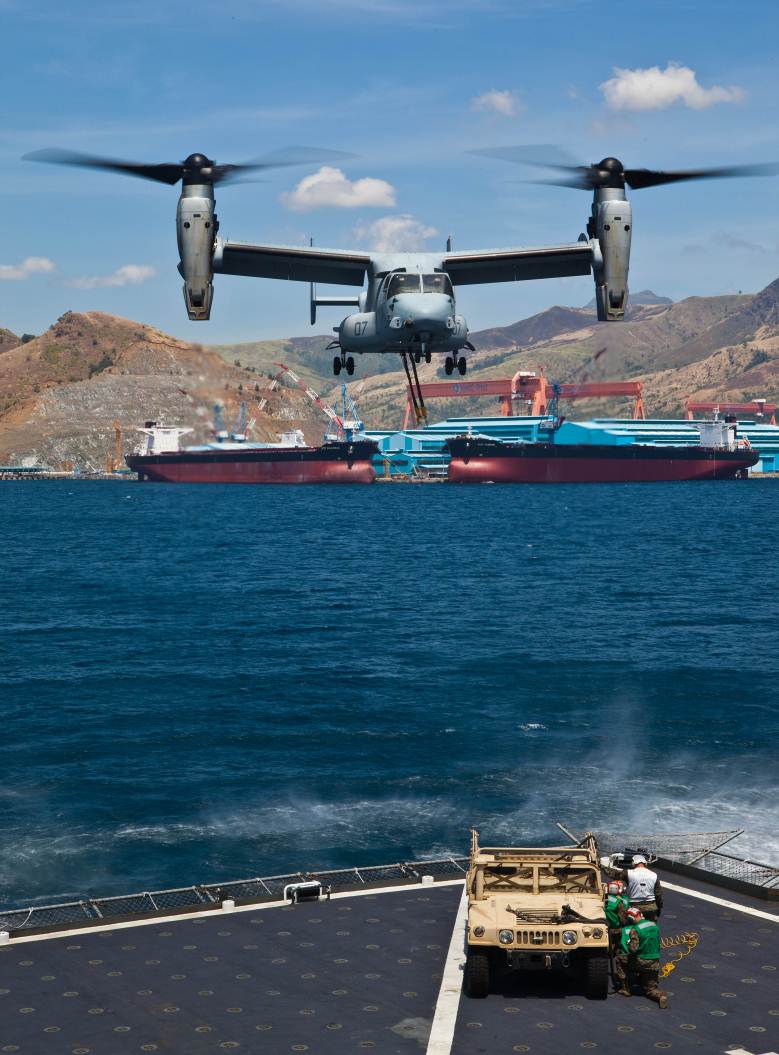 SUBIC BAY, Philippines – An MV-22B Osprey approaches the USNS Sacagawea to conduct an external lift of a high mobility multipurpose wheeled vehicle April 11 at Subic Bay, Republic of the Philippines, during exercise Freedom Banner 2013. This was the first time an Osprey has conducted an external lift with the Sacagawea. The aircraft is with Marine Medium Tiltrotor Squadron 265, Marine Aircraft Group 36, 1st Marine Aircraft Wing.  (U.S. Marine Corps photo by Pfc. Kasey Peacock/Released)