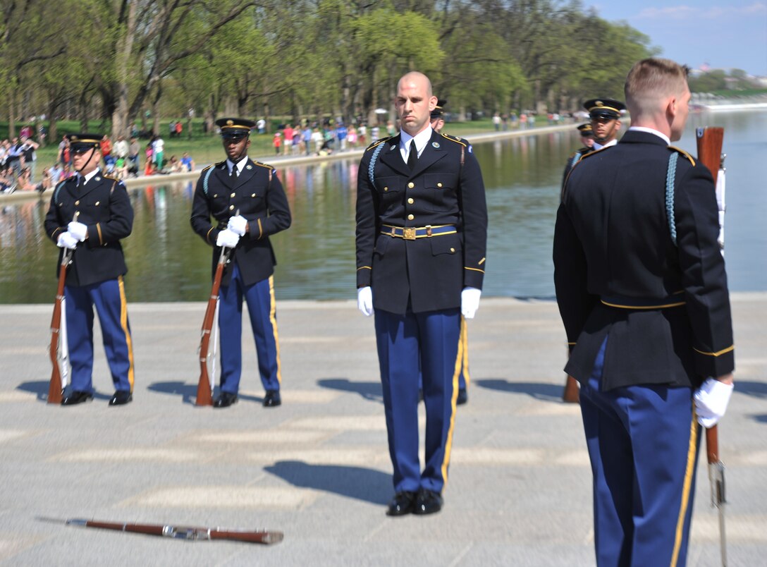 The Soldier with the U.S. Army Drill Team pauses to collect himself after he dropped a rifle during a drill performance April 13, 2013, at the National Cherry Blossom Festival in Washington, D.C. The drill movements the team performance are highly perfected choreographies that demand equal amounts of discipline and athletic skill. The team went on to recover and complete their performance under the applause and cheers of the audience. (U.S. Air Force photo/Airman 1st Class Alexander W. Riedel)