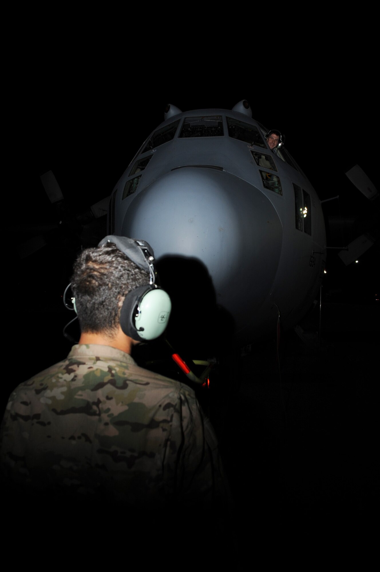 Staff Sgt. Carl Schmidt (in cockpit) and Senior Airman Bryan Perez, 41st Expeditionary Electronic Combat Squadron, prepare an EC-130H Compass Call for an engine test on the flightline on Bagram Airfield, Afghanistan, April 14, 2013. The 41st EECS recently reached 30,000 combat flight hours in Afghanistan. (U.S. Air Force photo/Staff Sgt. David Dobrydney)