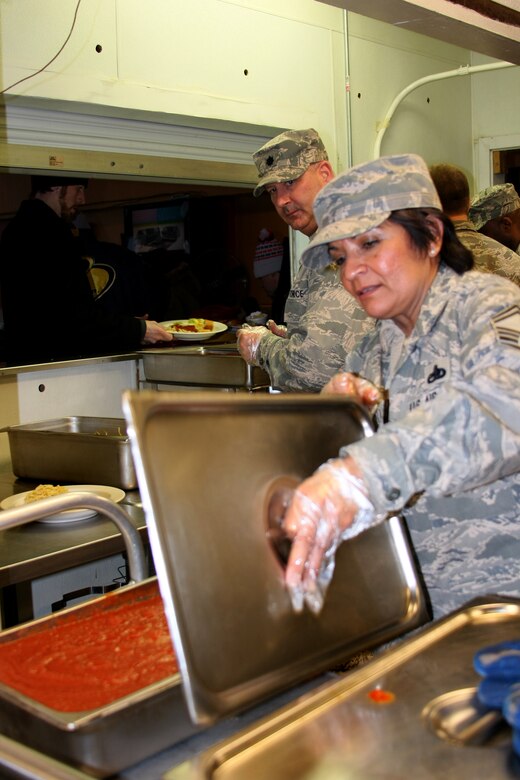 Senior Master Sgt. Annie Menchaca-Bratton prepares food for the homeless
at the Cherry Street Mission, Toledo, Ohio as part of a community
outreach project with the 180th Fighter Wing’s Logistics Readiness
Squadron in February. (Courtesy Photo/Released).