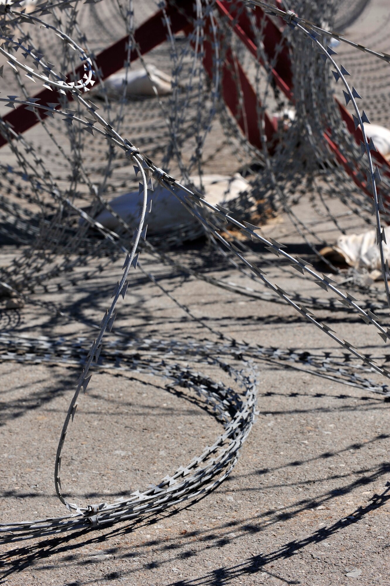Concertina wire is a key component in the Tactical Automated Security System. TASS, deployed and used at installations throughout the area of responsibility, is a collection of equipment, using different technologies, designed to secure multiple perimeters. The system is also self-sustaining and can be set up without power or communication infrastructure. (U.S. Air Force photo by Tech. Sgt. Christina M. Styer/Released) 