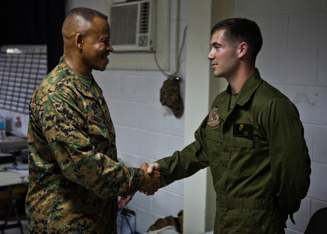 U.S. Marine Brig. Gen. Craig Q. Timberlake, left, shakes the hand of U.S. Marine Lance Cpl. Kyle A. Beane at Clark Field, Philippines April 6 during exercise Balikatan 2013.  Timberlake, commanding general of 3rd Marine Expeditionary Brigade, III Marine Expeditionary Force greeted Marines with 1st Marine Aircraft Wing as they planned for future training evolutions scheduled to take place during the exercise. The exercise, in its 29th iteration, is an annual bilateral training evolution aimed at ensuring interoperability of the Philippine and U.S. militaries during planning, contingency and humanitarian assistance operations. Beane is an MV-22 tiltrotor airframe mechanic with Marine Medium Tiltrotor Squadron 265, Marine Aircraft Group 36, 1st Marine Aircraft Wing, III Marine Expeditionary Force. 