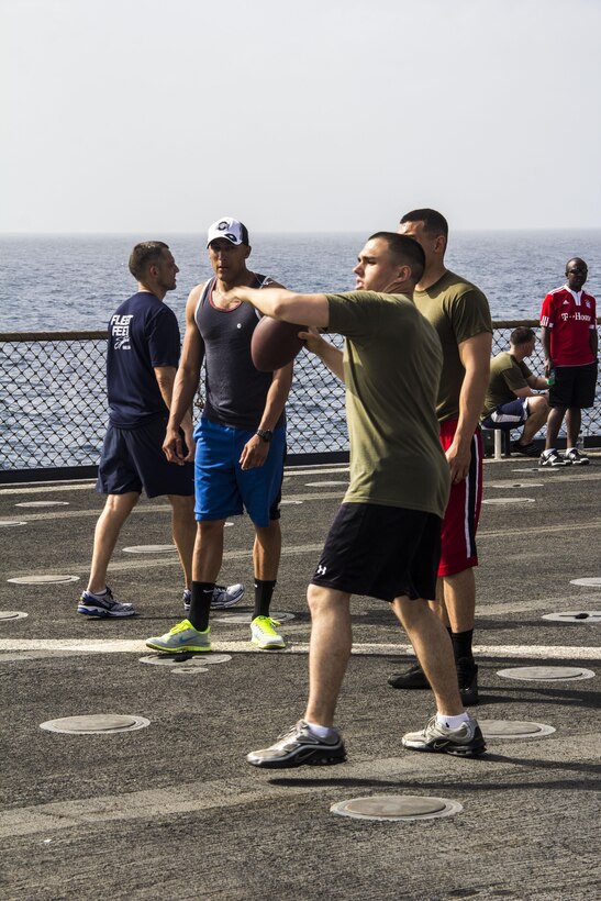 U.S. Marines and Sailors assigned to the 26th Marine Expeditionary Unit (MEU) and the USS Carter Hall (LSD 50) enjoy a cookout on the flight deck of the ship, eating food, playing games, and relaxing in the sun while at sea April 13, 2013. The MEU is currently deployed as part of the Kearsarge Amphibious Ready Group to the 5th Fleet area of operation. The 26th MEU operates continuously across the globe, providing the president and unified combatant commanders with a forward-deployed, sea-based quick reaction force. The MEU is a Marine Air-Ground Task Force capable of conducting amphibious operations, crisis response and limited contingency operations.
(U.S. Marine Corps photo by Cpl. Michael S. Lockett/Released)