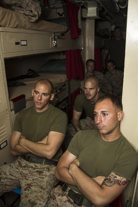 U.S. Marines and Sailors of the 26th Marine
Expeditionary Unit relax in berthing as they watch TV aboard the USS Carter Hall (LSD 50) while at sea April 14, 2013. The MEU is currently deployed as part of the Kearsarge Amphibious Ready Group to the 5th Fleet area of operation. The 26th MEU operates continuously across the globe, providing the president and unified combatant commanders with a forward-deployed,  sea-based quick reaction force. The MEU is a Marine Air-Ground Task Force capable of conducting amphibious operations, crisis response and limited contingency operations. 
(U.S. Marine Corps photo by Cpl. Michael S.
Lockett/Released)