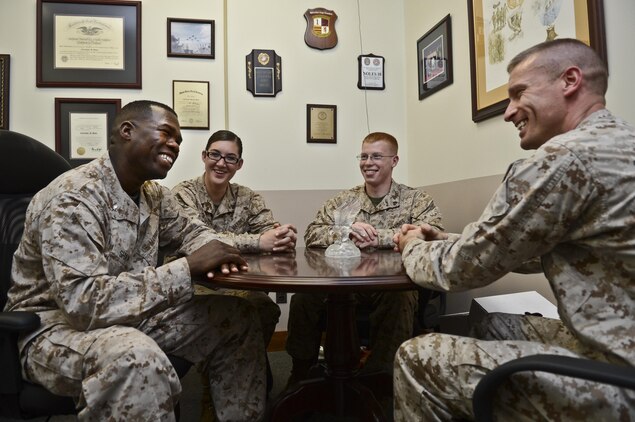 Lt. Col. Christopher B. Shaw, Marine Corps Base Quantico Staff Judge Advocate, takes a moment to mentor his Marines in his office at Lejeune Hall on April 11, 2013. Shaw’s most rewarding experiences have been helping individual Marines and commands.