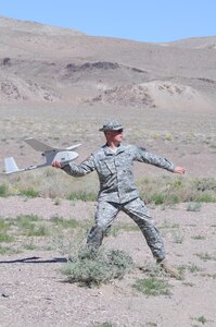 Sgt. Eric Hintermeyer of the Nevada National Guard's Counterdrug Task Force launches a Raven unmanned aerial vehicle during the 2008 Vigilant Guard exercise on June 13 in Fallon, Nev. During the exercise, the small aircraft displayed to emergency responders its ability to assist incident commanders with reconnaissance and intelligence capabilities during domestic contingencies.