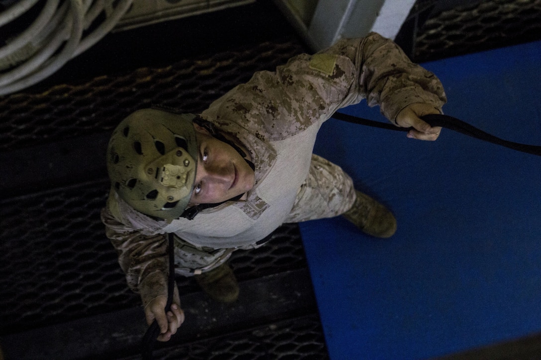 U.S. Marines and U.S. Sailors assigned to Battalion Landing Team 3/2, 26th Marine Expeditionary Unit (MEU), conduct rappelling exercises aboard the USS Kearsarge (LHD 3) while at sea April 15, 2013. The 26th MEU is deployed to the 5th Fleet area of operations aboard the Kearsarge Amphibious Ready Group. The 26th MEU operates continuously across the globe, providing the president and unified combatant commanders with a forward-deployed, sea-based quick reaction force. The MEU is a Marine Air-Ground Task Force capable of conducting amphibious operations, crisis response and limited contingency operations. (U.S. Marine Corps photo by Cpl. Kyle N. Runnels/Released)