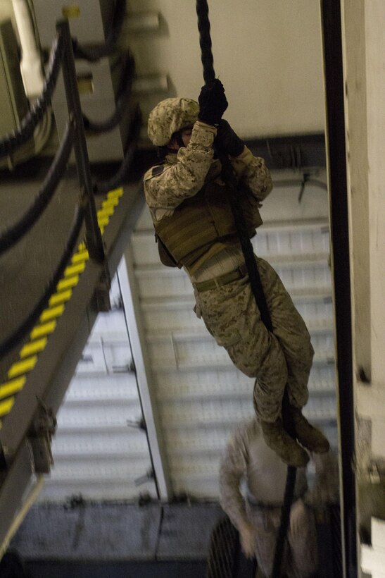 U.S. Marines and U.S. Sailors assigned to Battalion Landing Team 3/2, 26th Marine Expeditionary Unit (MEU), conduct fast rope exercises aboard the USS Kearsarge (LHD 3) while at sea April 15, 2013. The 26th MEU is deployed to the 5th Fleet area of operations aboard the Kearsarge Amphibious Ready Group. The 26th MEU operates continuously across the globe, providing the president and unified combatant commanders with a forward-deployed, sea-based quick reaction force. The MEU is a Marine Air-Ground Task Force capable of conducting amphibious operations, crisis response and limited contingency operations. (U.S. Marine Corps photo by Cpl. Kyle N. Runnels/Released)