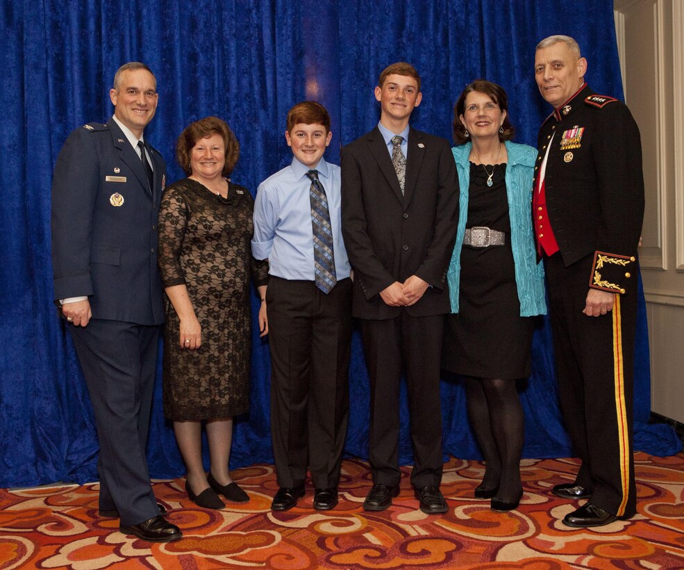 From the left: Col. Brian Newberry, Mrs. Jill Newberry, Matthew Newberry, and Air Force Military Child of the Year, Mark Newberry, Mrs. Debbie Paxton and the Assistant Commandant of the Marine Corps, Gen. John M. Paxton, Jr., pose for a photo during the reception before the Military Child of the Year Awards Gala in Crystal City, VA, April 11, 2013. This year was Operation Homefront's 5th annual Awards Gala to recognize one child from each of the five services for the strength, courage and achievements of our nation's youngest patriots. (U.S. Marine Corps photo by Cpl. Tia Dufour/Released)