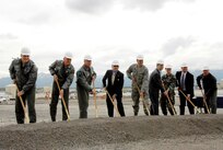 From left to right: Brig. Gen. Thomas Tinsley, Elmendorf Air Force Base 3rd Wing commander; Brig. Gen. Tony Hart, Kulis Air National Guard Base 176th Wing commander; Gen. Carrol H. "Howie" Chandler, Pacific Air Forces commander; Sen. Ted Stevens; Maj. Gen. Craig Campbell, Alaska National Guard, adjutant general; Lt. Gov. Sean Parnell, Sr.; Airman Charity Orriss of the 212th Rescue Squadron; Bud Alto of the CH2M Hill Construction Company; and Lt. Gen. Dana Atkins, commander of Alaskan Command, break ground on June 30 at the Elmendorf Air Force Base construction site that will be the new home to the 176th Alaska Air National Guard Wing.