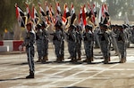Iraqi National Police Officers stand in formation prior to graduation ceremonies at Camp Dublin, Iraq, for the newest members of the Iraqi National Police Quick Reaction Force, Tuesday, Dec. 19, 2007. The Quick Reaction Force is responsible for responding tactically to a viriety of situations and was trained by the Italian Carabinieri police force.