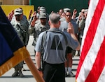 Colonel Brian K. Balfe, commander of Combined Joint Task Force Phoenix leads 20 re-enlisting Soldiers of the New York Army National Guard in the oath of service from Patriot Square, Camp Phoenix, Kabul on July 4.