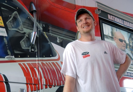 NASCAR Driver Dale Earnhardt Jr. talks with members of the Florida National Guard in the infield of the Daytona International Speedway prior to the running of the Coke Zero 400 race July 5, 2008.