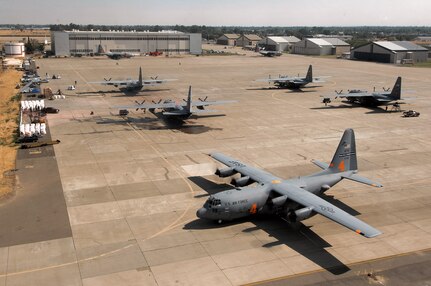 A C-130 Hercules from the Air Force Reserve Command's 302nd Airlift Wing at Peterson Air Force Base, Colo., equipped with the modular airborne firefighting system, taxies to the runway at McClellan Airfield, Calif., July 5 to begin firefighting operations. Aircraft from the 302nd AW are conducting firefighting support missions as part of the 302nd Air Expeditionary Group.