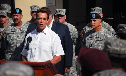 Major General William H. Wade stands with Governor Arnold Schwarzenegger as he thanks the National Guard at the Wild Fire Training Academy, held on McClellan Air Park, California. Governor Schwarzenegger made it a point to personally thank the National Guardsmen for all they have sacrificed to help with the wild fires.