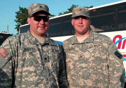 Twin brothers Sgts. Daniel (left) and Timothy DeKoeyer prepare to deploy with the Florida Army National Guard's 715th Military Police Company in Melbourne, Fla., July 5, 2008.