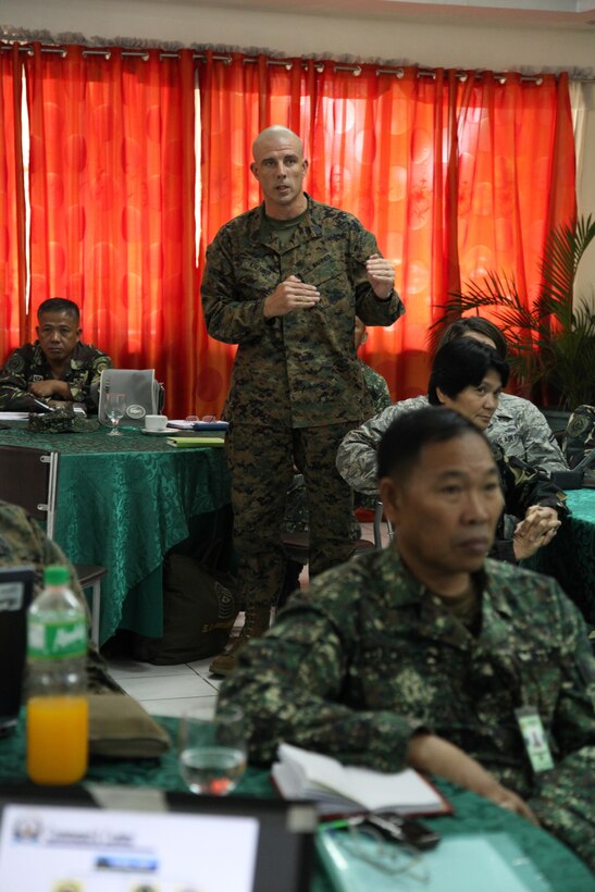U.S. Marine Sgt Maj. Howard L. Kreamer asks a question on the Armed Forces of the Philippines slide during the Philippine-U.S. Senior Enlisted Seminar and Team Building Event 2013 April 6 at the Commissioned Officers’ Club at Camp Emilio Aguinaldo. The seminar is part of Balikatan 2013, an annual bilateral exercise in its 29th iteration which provides a venue for AFP and U.S. military forces to develop and continue to enhance interoperability across a wide range of military actions. The focus of the seminar will be the sharing of knowledge by senior enlisted from both nations on how to adapt and improve enlisted training, develop an understanding of the differences in career progression and continue to strengthen military-to-military relations. Howard is the command sergeant major for III Marine Headquarters Group, III Marine Expeditionary Force. 