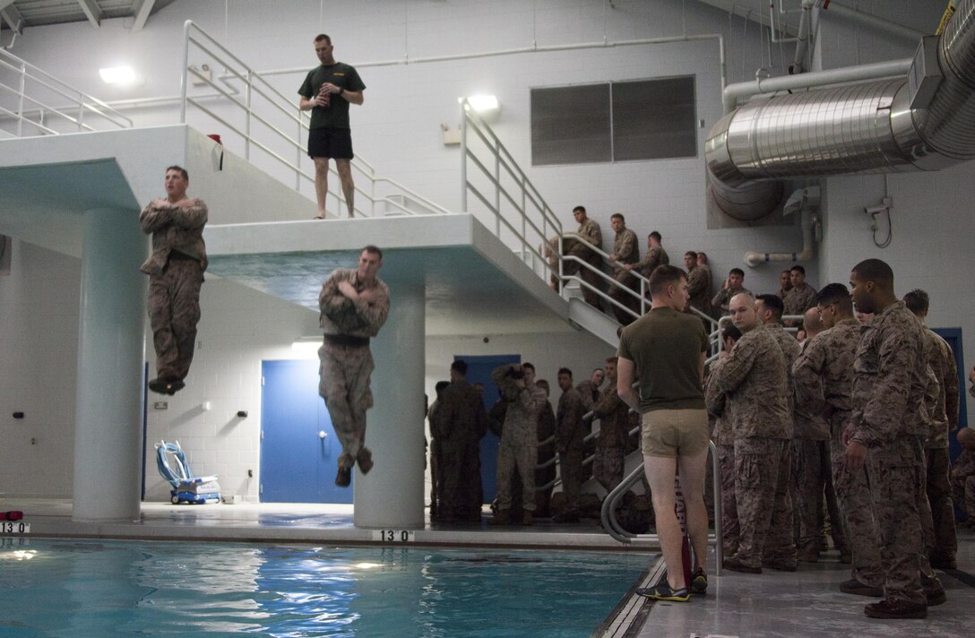 22nd Marine Expeditionary Unit Marines preform an abandoned ship exercise at the training pool aboard Marine Corps Base Camp Lejeune, N.C., for annual swim qualificatioin April 5, 2013. The 22nd MEU is constantly training to maintain a high state of readiness. (Marine Corps Photo by Lance Cpl. Caleb McDonald/Released)