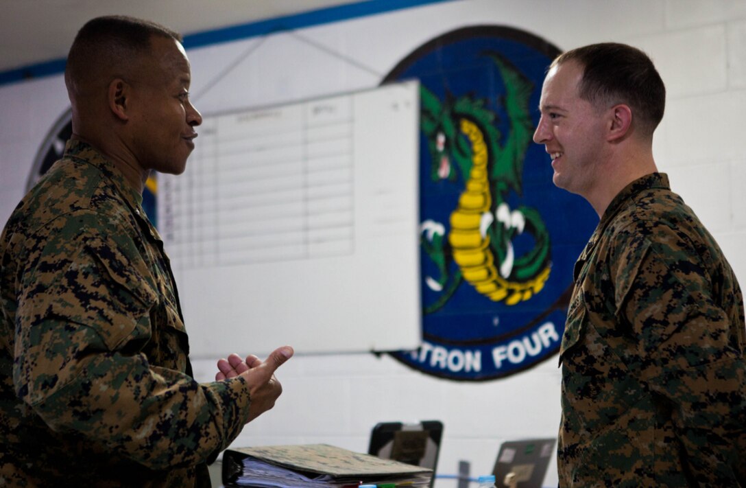 Brig. Gen. Craig Q. Timberlake, left, greets Sgt. Michael J. Holmes at Clark Air Base, Republic of the Philippines April 6 during exercise Balikatan 2013. Timberlake, commanding general of 3rd Marine Expeditionary Brigade, III Marine Expeditionary Force greeted Marines with 1st Marine Aircraft Wing as they planned for future training evolutions scheduled to take place during the exercise. The exercise, in its 29th iteration, is an annual bilateral training evolution aimed at ensuring interoperability of the Philippine and U.S. militaries during planning, contingency and humanitarian assistance operations. Holmes an F/A-18 fixed-wing aircraft airframe mechanic with with Marine All-Weather Fighter Attack Squadron 533, Marine Aircraft Group 31, 2nd Marine Aircraft Wing, II Marine Expeditionary Force, currently attached to Marine Aircraft Group 36, 1st MAW, III MEF under the unit deployment program.