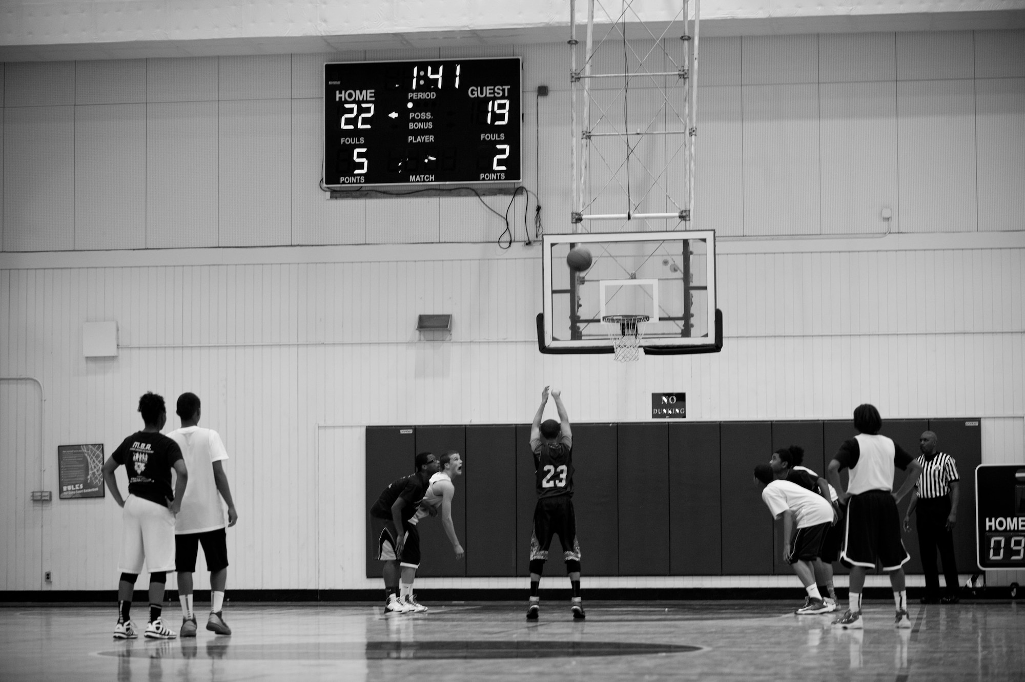 Players wait for the break of a free-throw during an All Star Game at the Mainland Basketball Camp at Yokota Air Base, Japan, April 12, 2013. One hundred fourteen children from throughout the Pacific military region came to the camp to display their athletic ability in front of college coaches throughout the United States and to build on their current basketball skills. (U.S. Air Force photo by Cody H. Ramirez/Released)
