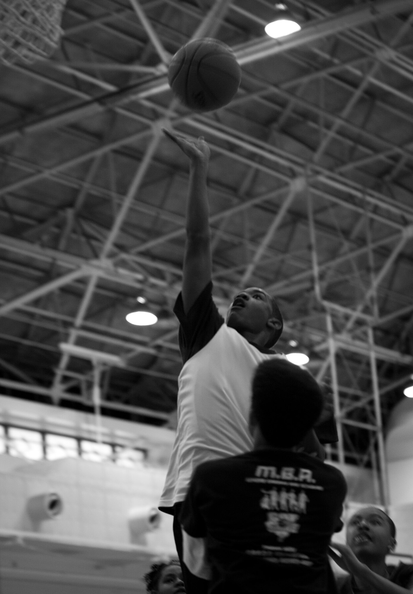 A player releases the ball for a layup during the All Star Game at the Mainland Basketball Camp at Yokota Air Base, Japan, April 12, 2013. The All Star Game took place at the end of the week-long camp and included the players who displayed the best athletic ability throughout the camp. (U.S. Air Force photo by Senior Airman Cody H. Ramirez/Released))